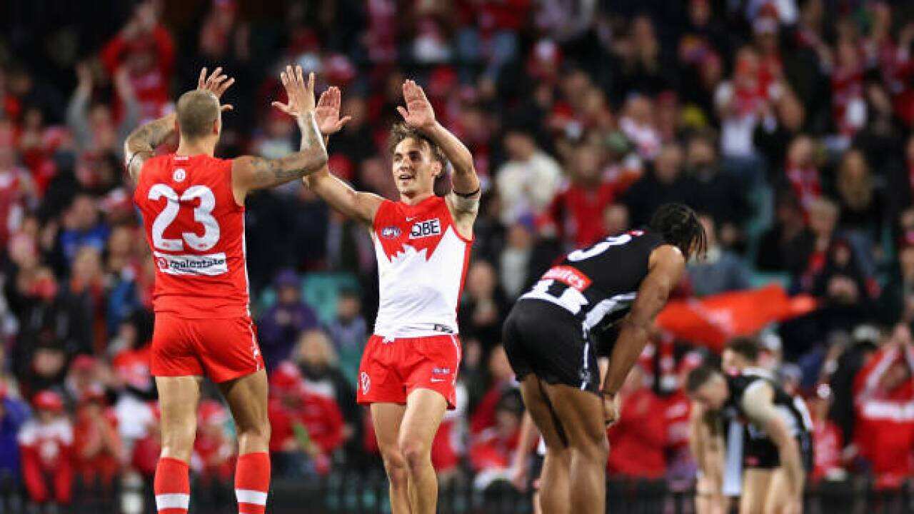 gRyan Clarke of the Swans and Lance Franklin of the Swans celebrate winning the round 22 AFL match between the Sydney Swans and the Collingwood Magpies at Sydney.