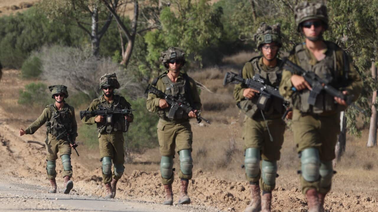 Israeli troops gather near the Gaza border, southern Israel