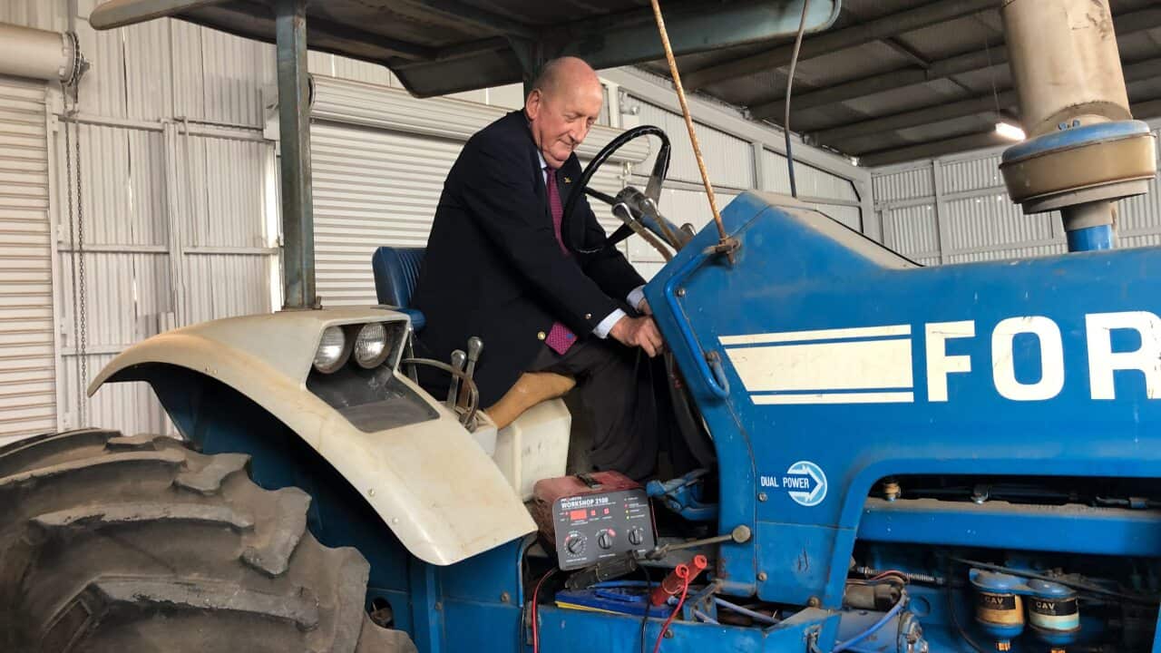 Former Nationals leader Tim Fischer on his first tractor at Gunyah Museum in Lockhart, NSW.