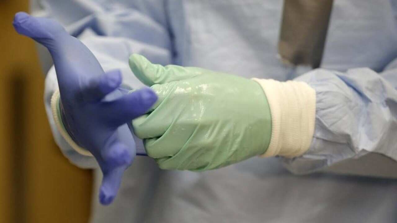 Nurse Keene Roadman dressed in personal protective equipment