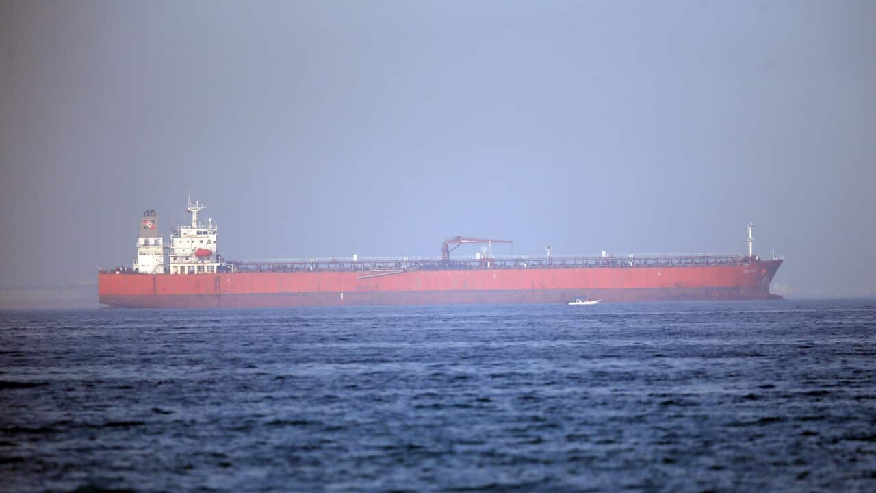 A ship sailing towards Fujairah port at Fujairah coast, United Arab Emirates.