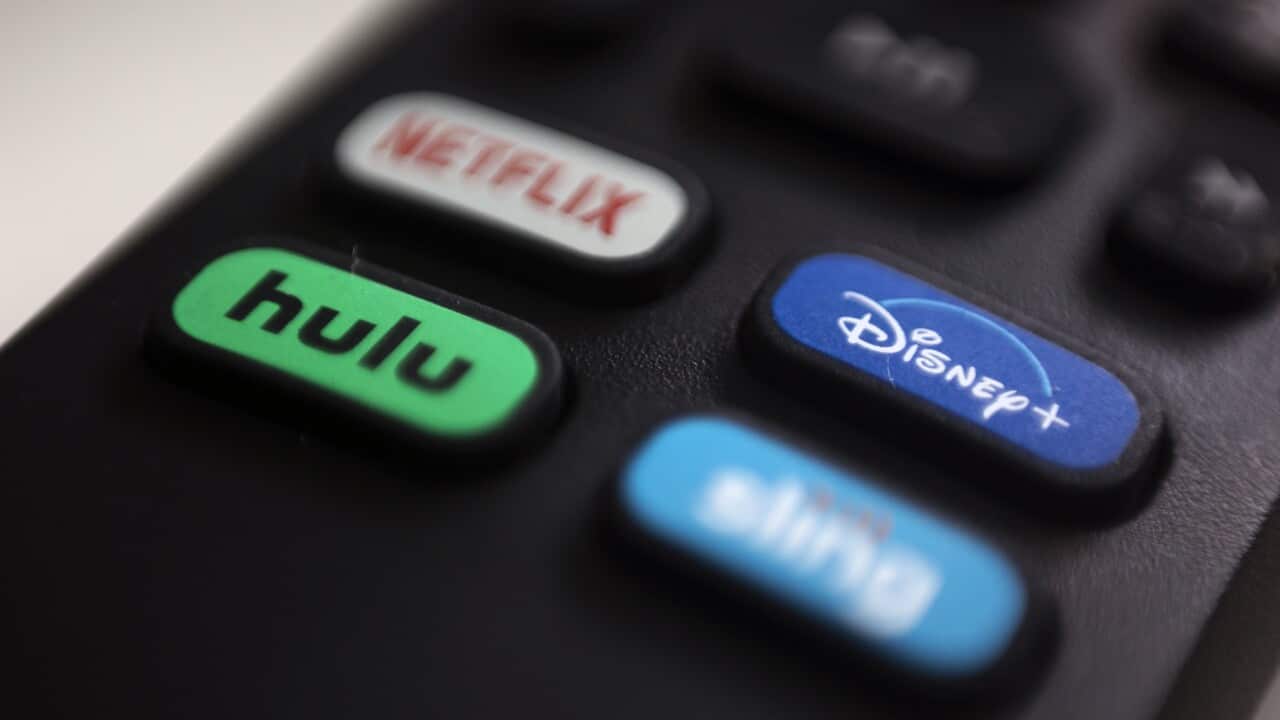 A remote with buttons that read Netflix, Hulu, Disney +
