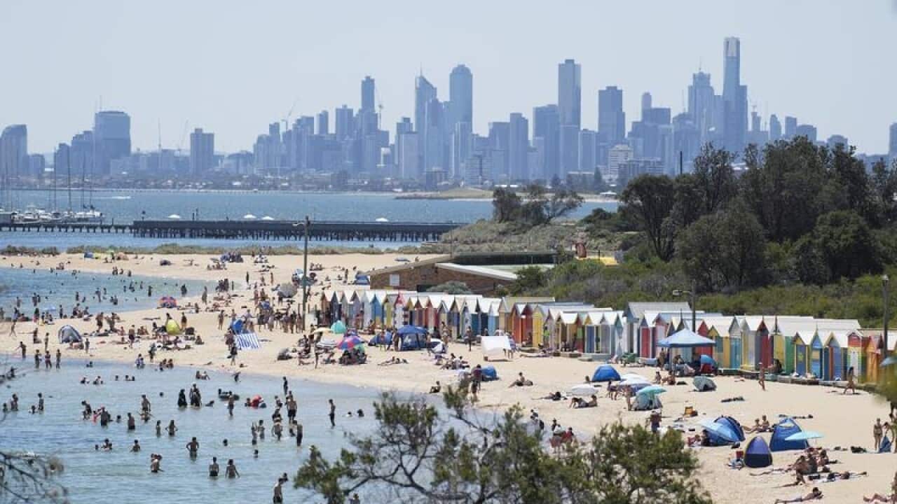 People are seen during a at Brighton Beach.