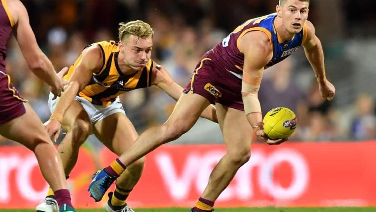 A file image of Dayne Zorko punting the ball.