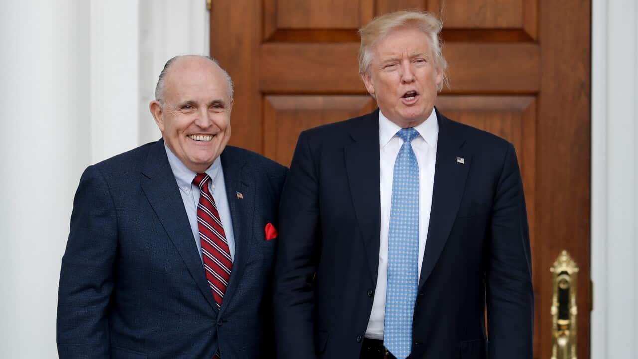 File photo of then-President-elect Donald Trump, right, and former New York Mayor Rudy Giuliani 