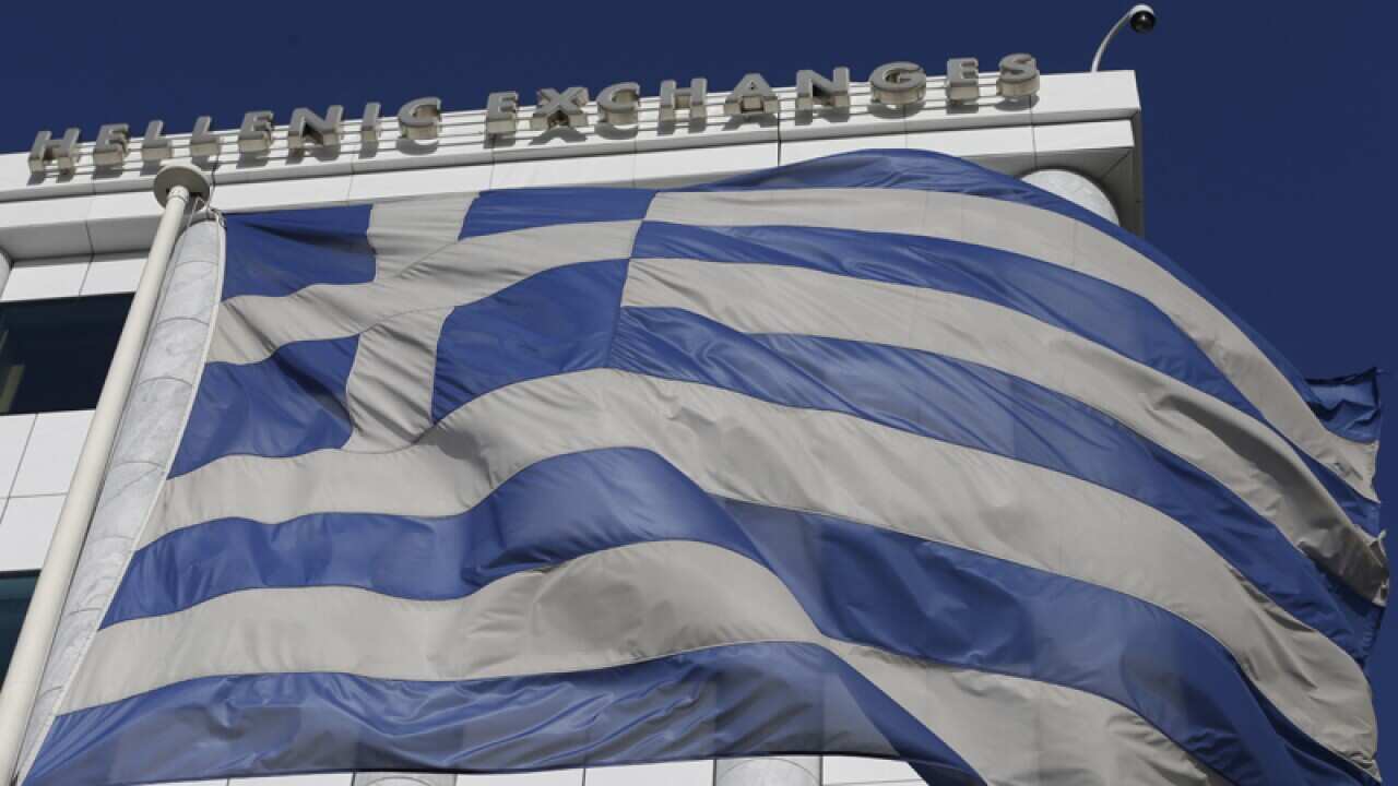A Greek flag outside the Stock Exchange in Athens