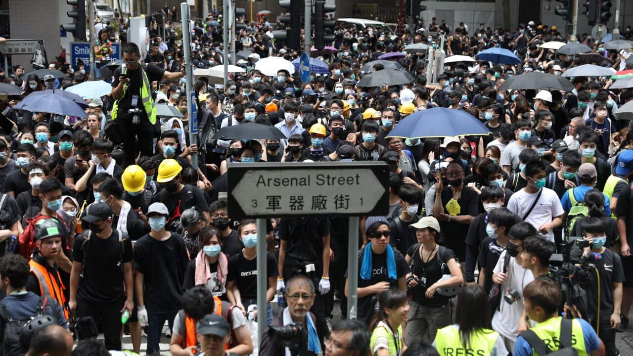 Protesters gather outside the Wanchai Police headquarters demanding the release of protesters arrested during clashes in Hong Kong, China.