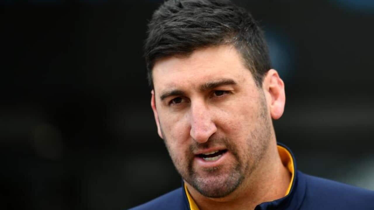 Dean Cox speaks to the media