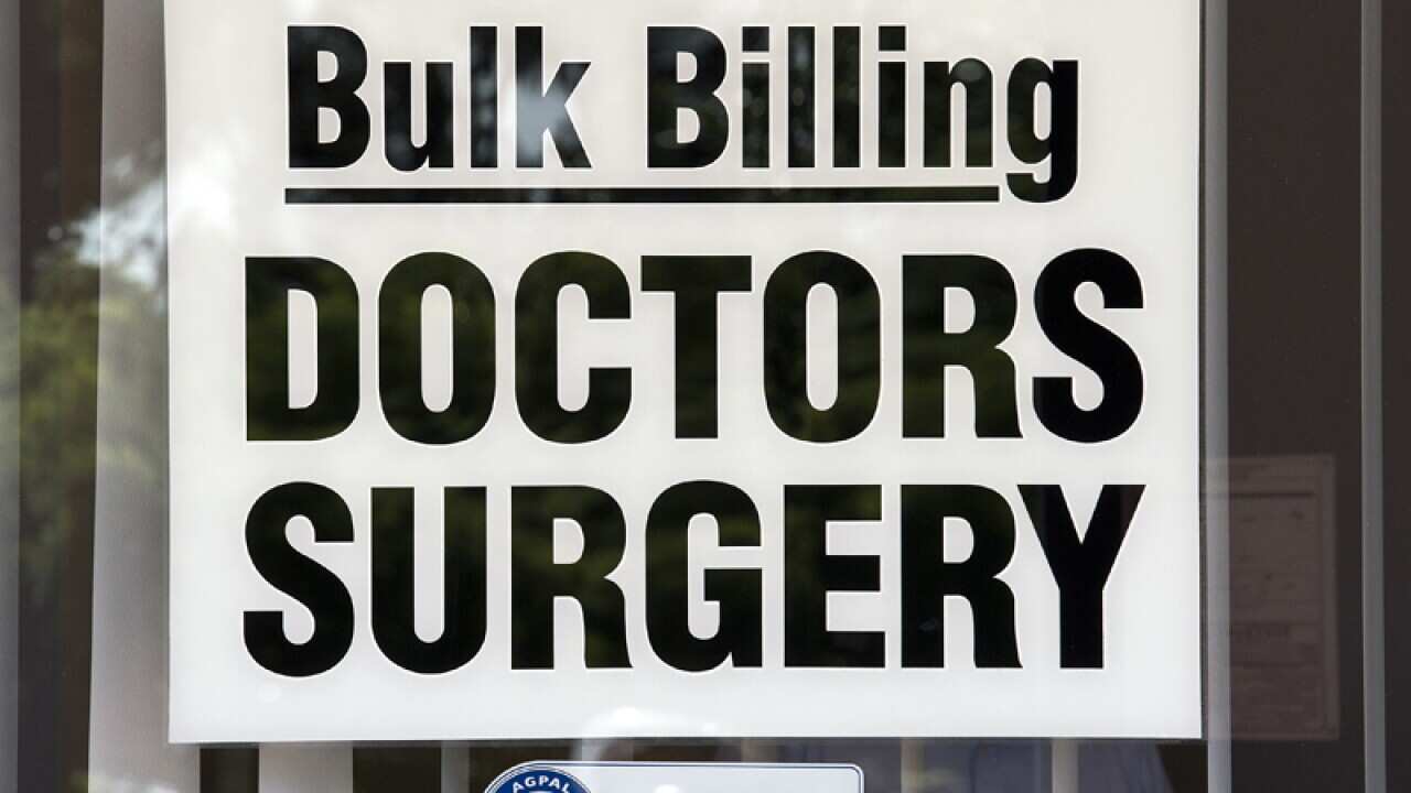 A Bulk Billing sign on a window of a doctors surgery