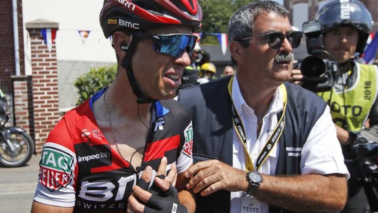 Australian cyclist Richie Porte (L) after sustaining an injury