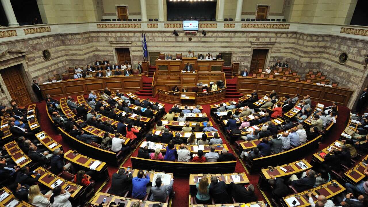 After a long, tense session that lasted all night, the Greek parliament approved a third bailout agreement on 14th August 2015. (AAP)