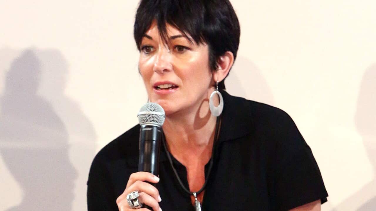 Ghislaine Maxwell sitting on a couch while speaking into a microphone.