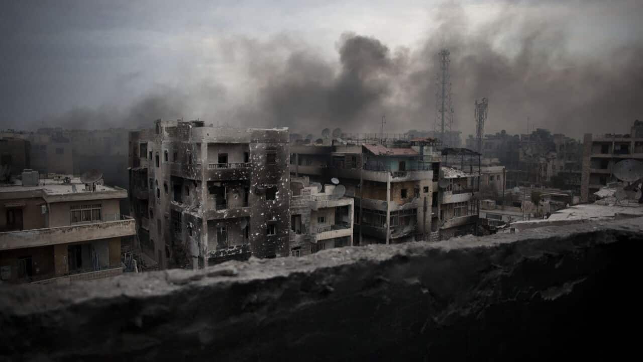 In this Oct. 2, 2012 file photo, smoke rises over Saif Al Dawla district, in Aleppo, Syria