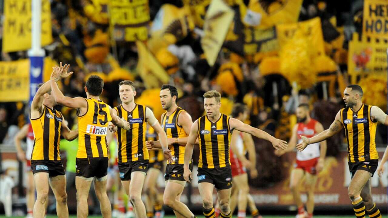 Hawthorn players celebrate