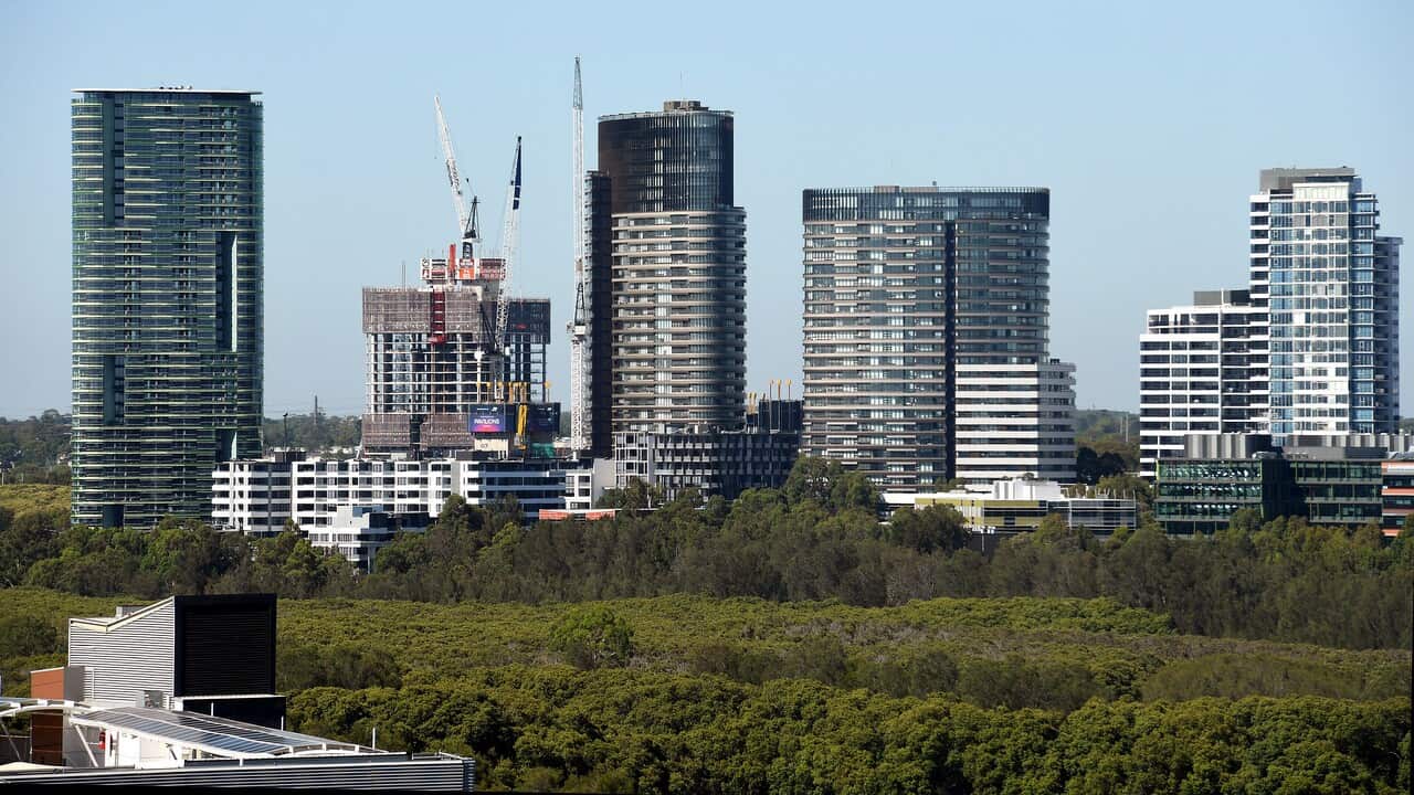 The Opal Tower (left) is seen at Sydney Olympic Park in Sydney, Monday, December 25, 2018.