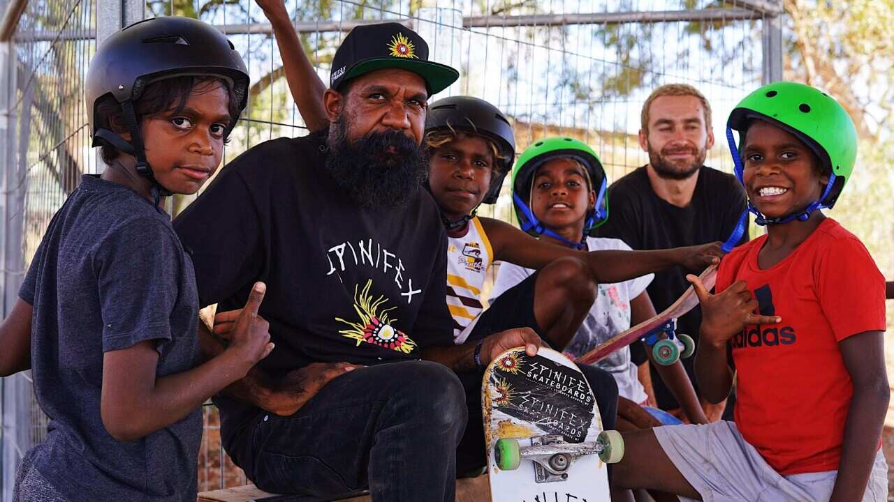 Nicky Hayes and some of his young skateboarders