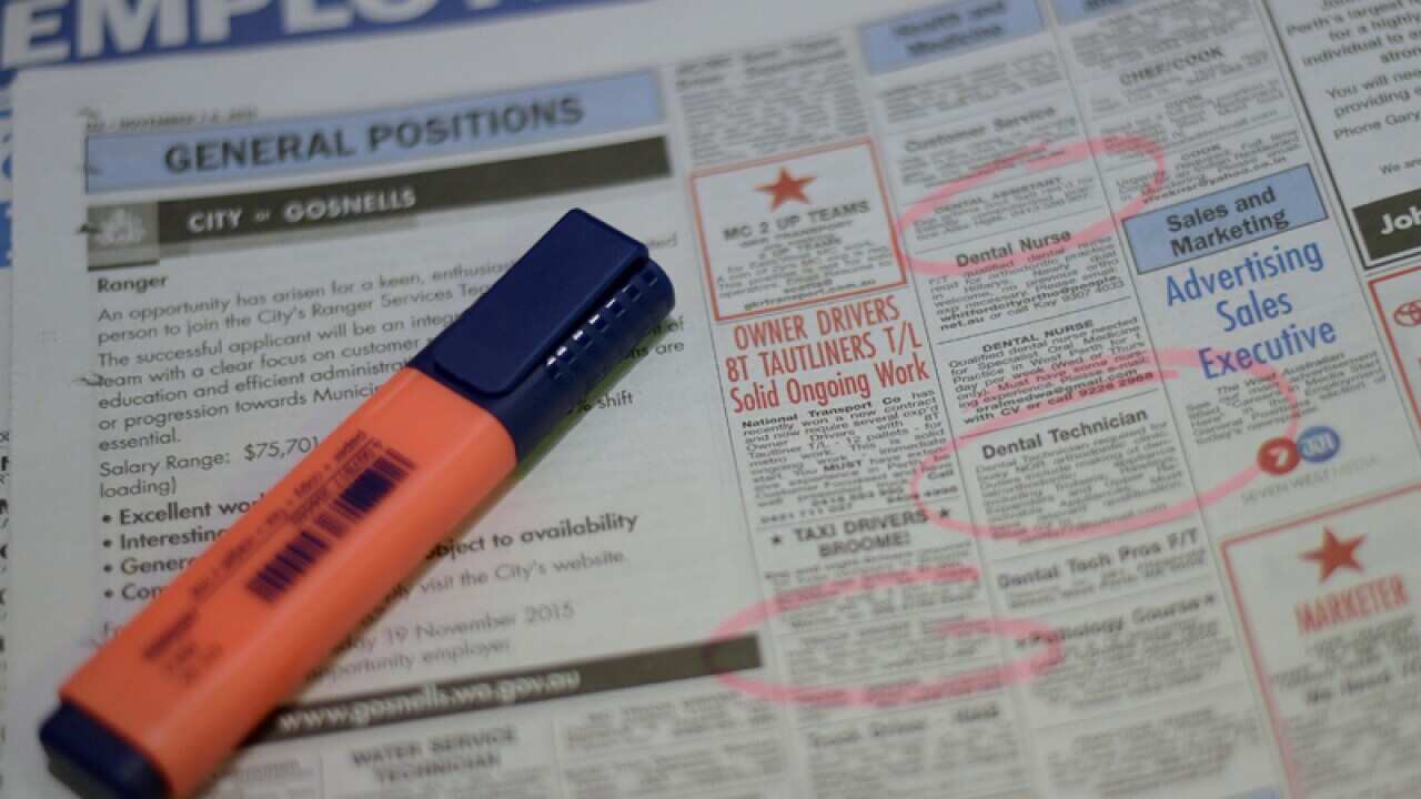 Job adverts are seen in a weekend newpaper in Canberra