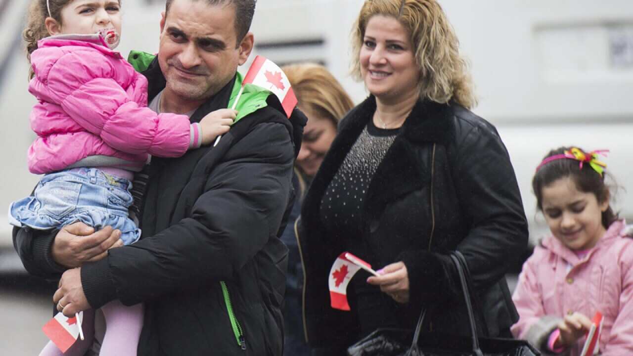 Syrian refugees meet sponsors and relatives in Toronto