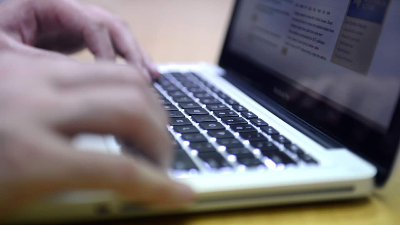 A man uses a laptop computer. (AAP)
