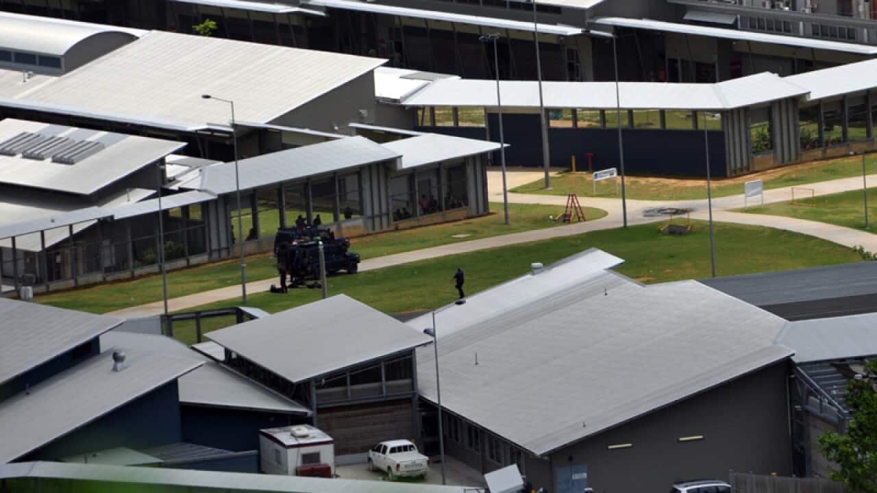 Police officers at the Christmas Island detention centre