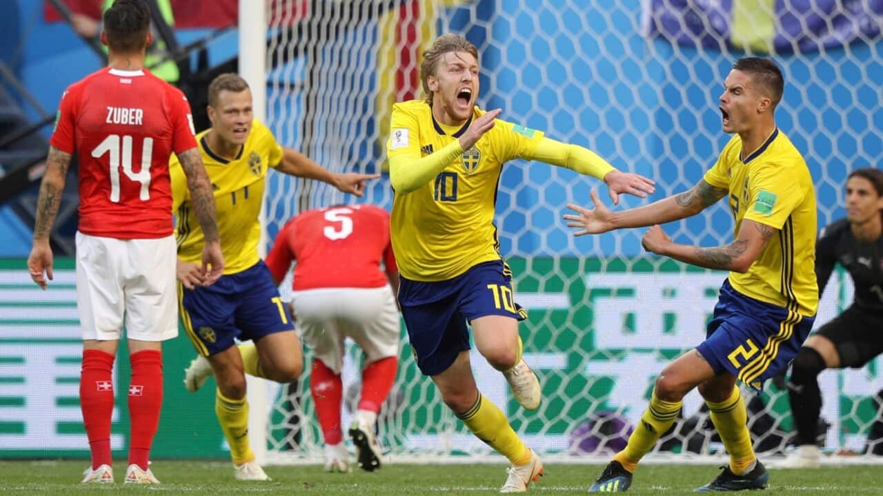 Emil Forsberg (C) reacts after scoring an opener in the second half during the match of the Round of 16 in FIFA World Cup Russia at Saint Petersburg Stadium