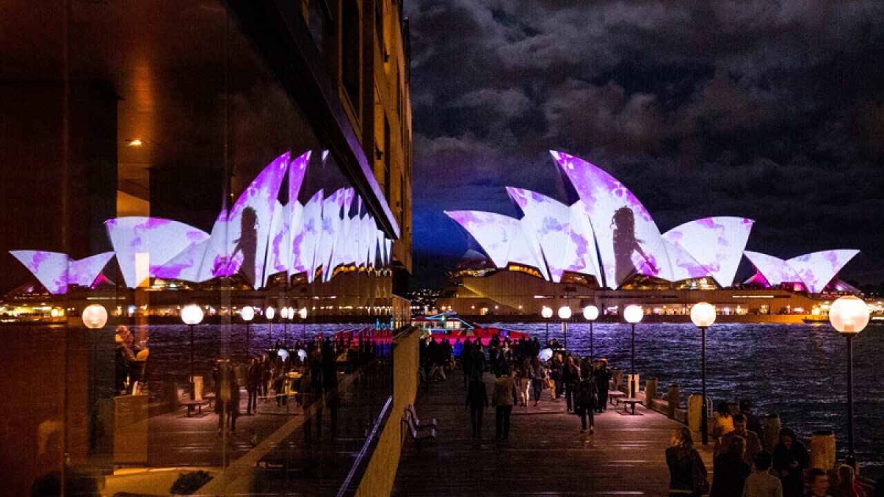 A reflection of the Opera House in the Park Hyatt Hotel window