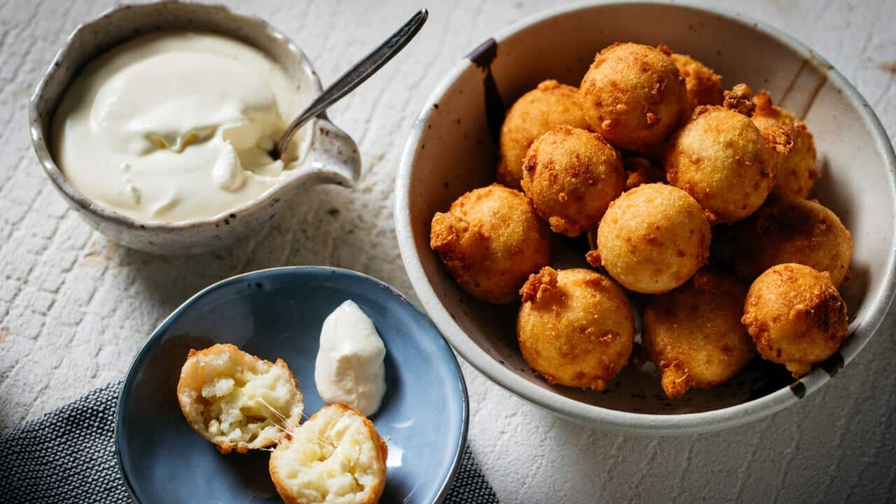 Cheesy arepa balls with quick Venezuelan sour cream (natilla)