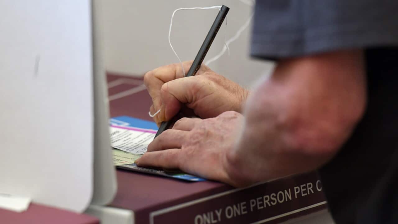A voter at a polling booth during the Queensland state election