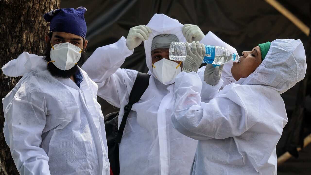 Health workers at a COVID-19 centre in Mumbai, India on 24 May 2021.