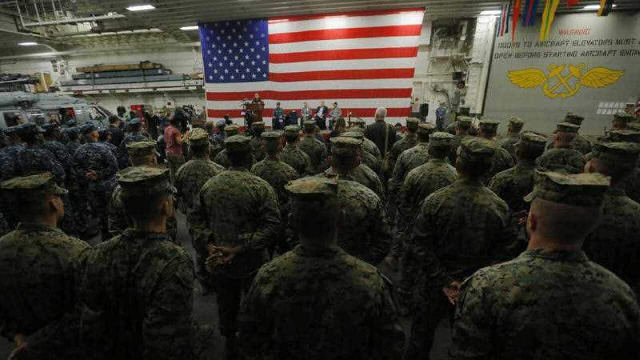 U.S. Navy Admiral Harry Harris, Commander of the U.S. Pacific Command, speaks in front of US Marines at a ceremony.