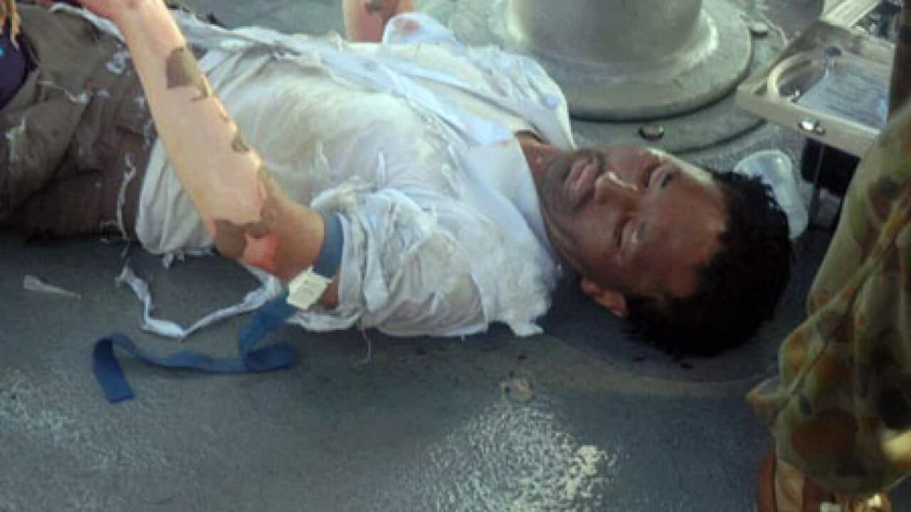 SIEV_36_injured_afghan_100202_B_PrCustoms_1851407302