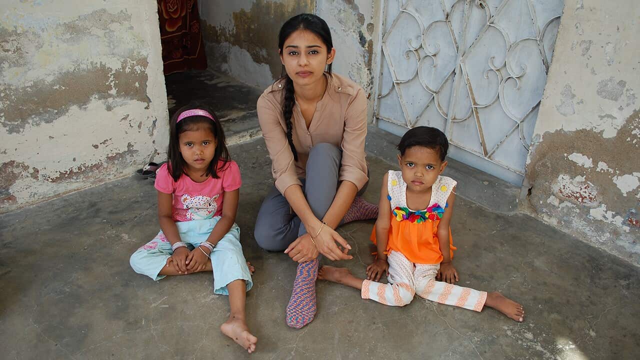 Reporter Nelufar Hedayat with Maheen and Mariam - their father refused to give them polio drops and they now both have polio.