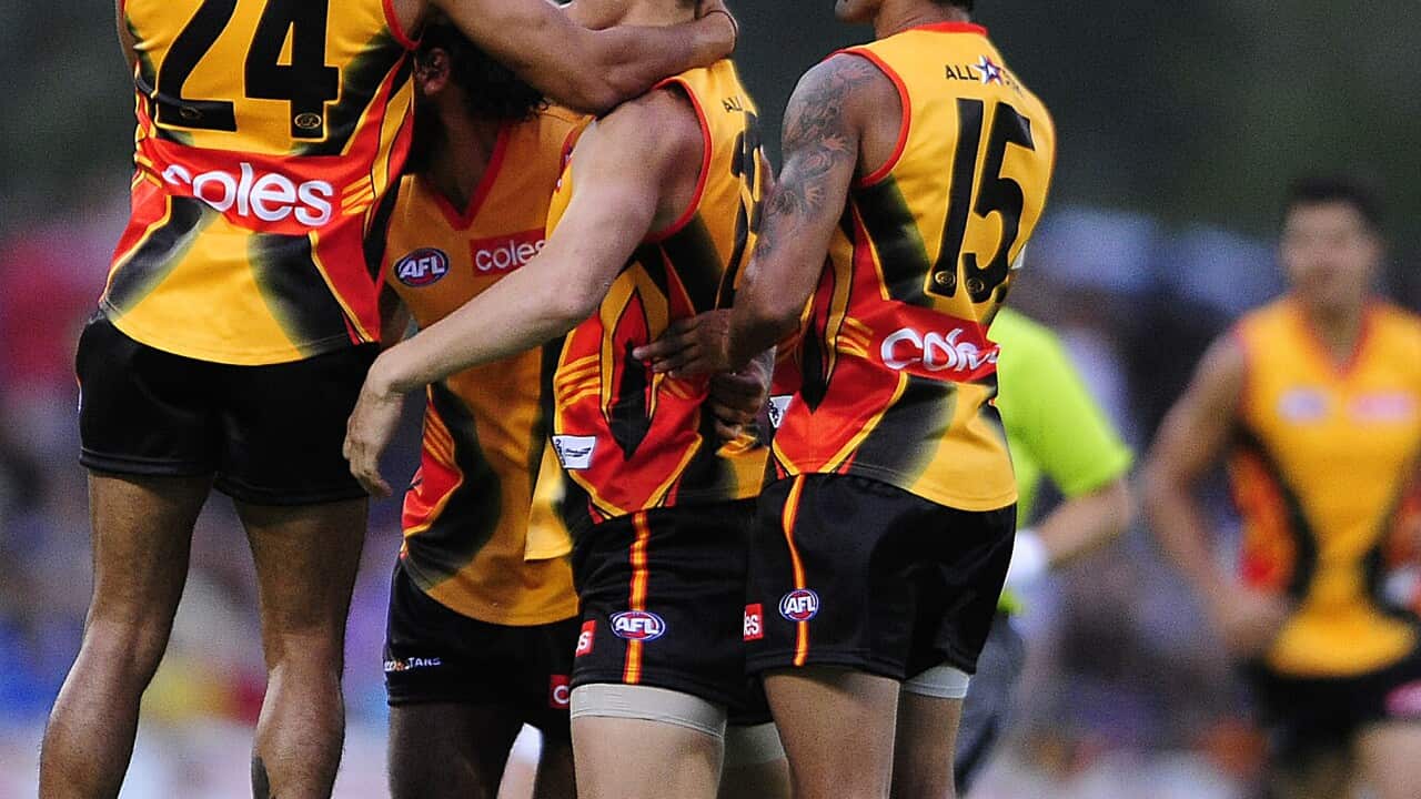 Sharrod Wellingham (left) and Courtney Dempsey (right) celebrate during AN AFL pre-season match (AAP)