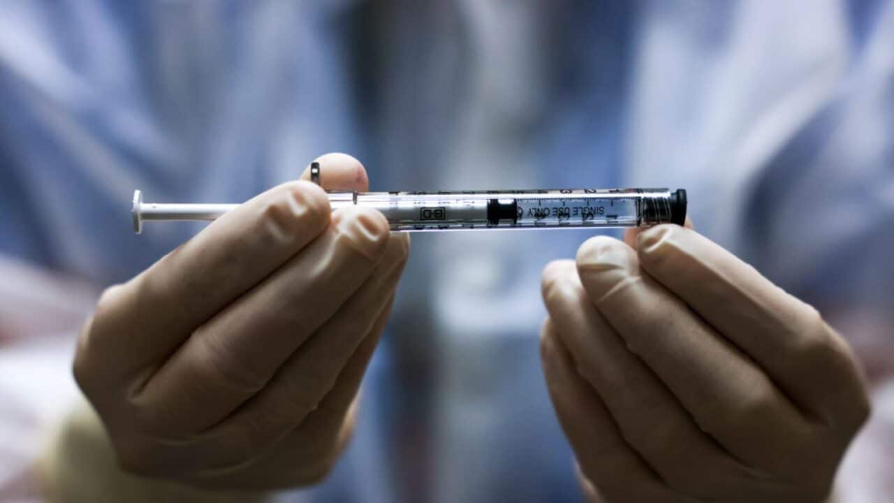A COVID-19 vaccine dose.