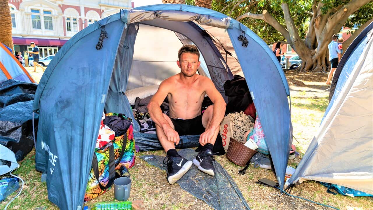 Luke (34) who has been on the streets for over two years sits in his tent in the tent city in Pioneer Park in Fremantle, Friday, January 22, 2021.