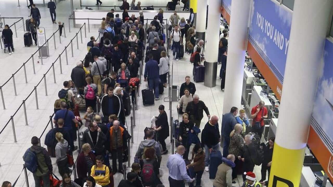 Passengers queue for flights at Gatwick Airport