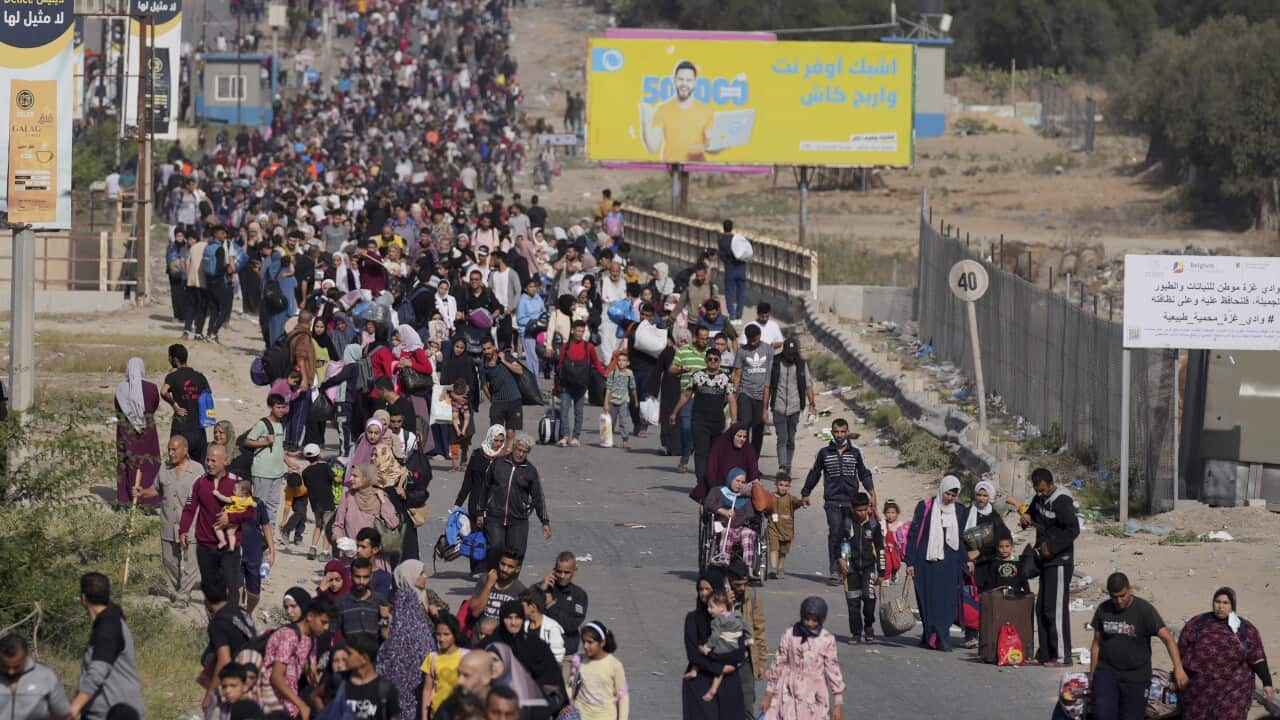 People walking down a road in Gaza