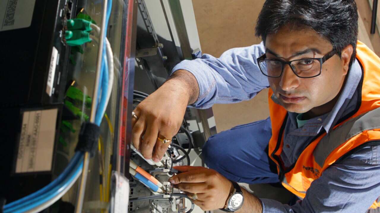 NBN technician Rajav Kapil connecting an apartment block to the NBN