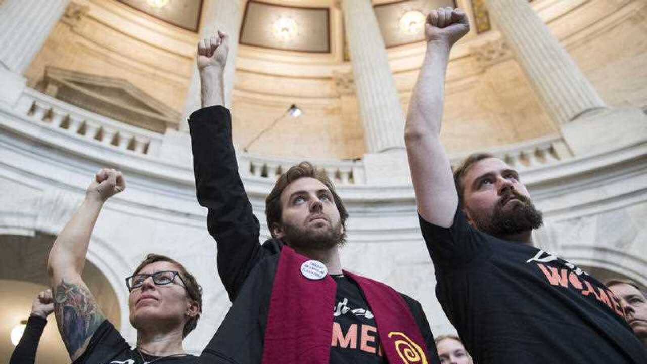Protesters, including Yale Law student Sam Davis, march in Russell Building to oppose the nomination of Supreme Court nominee Brett Kavanaugh on September 24, 2018.