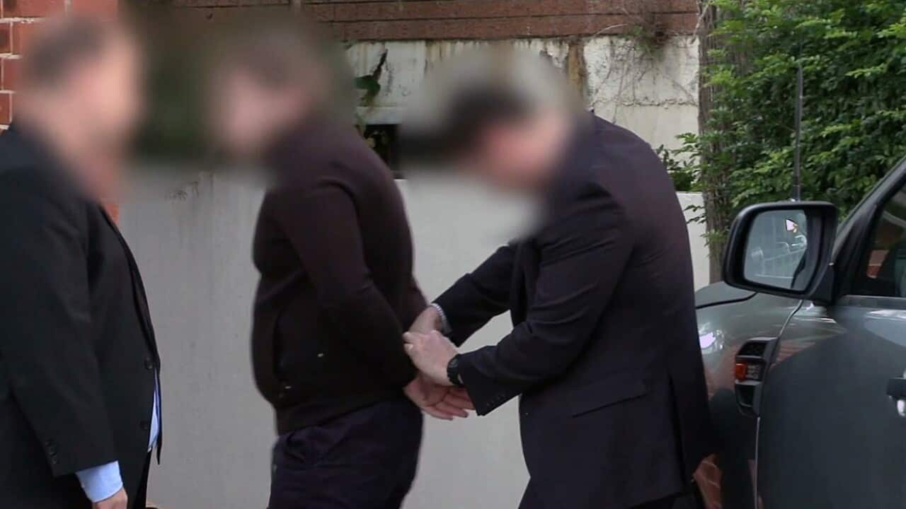 A screenshot obtained Thursday, May 18, 2017 of one of nine people being arrested over a $165 million tax fraud investigation. 