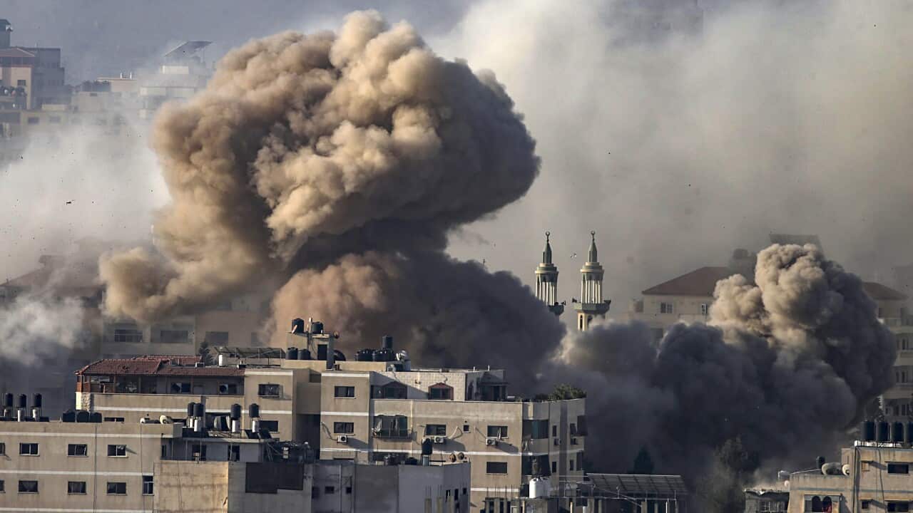 Smoke billows from buildings after an airstrike.