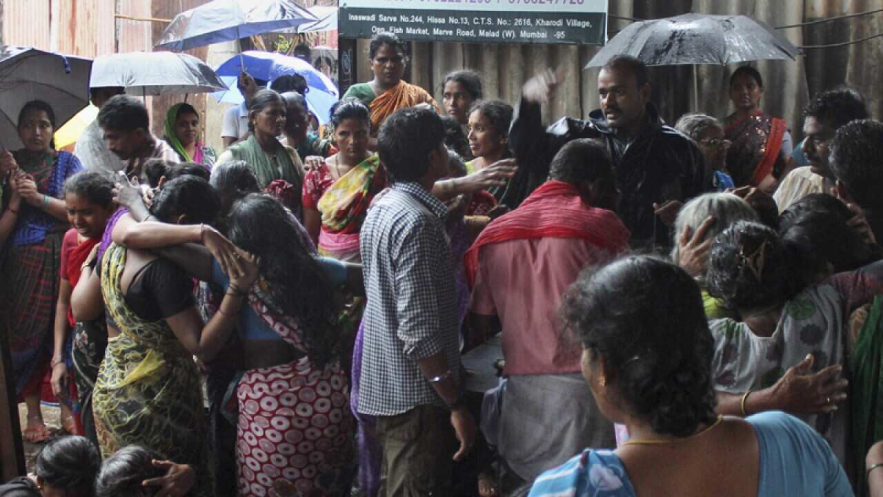 Family members of people who died after drinking tainted liquor wail