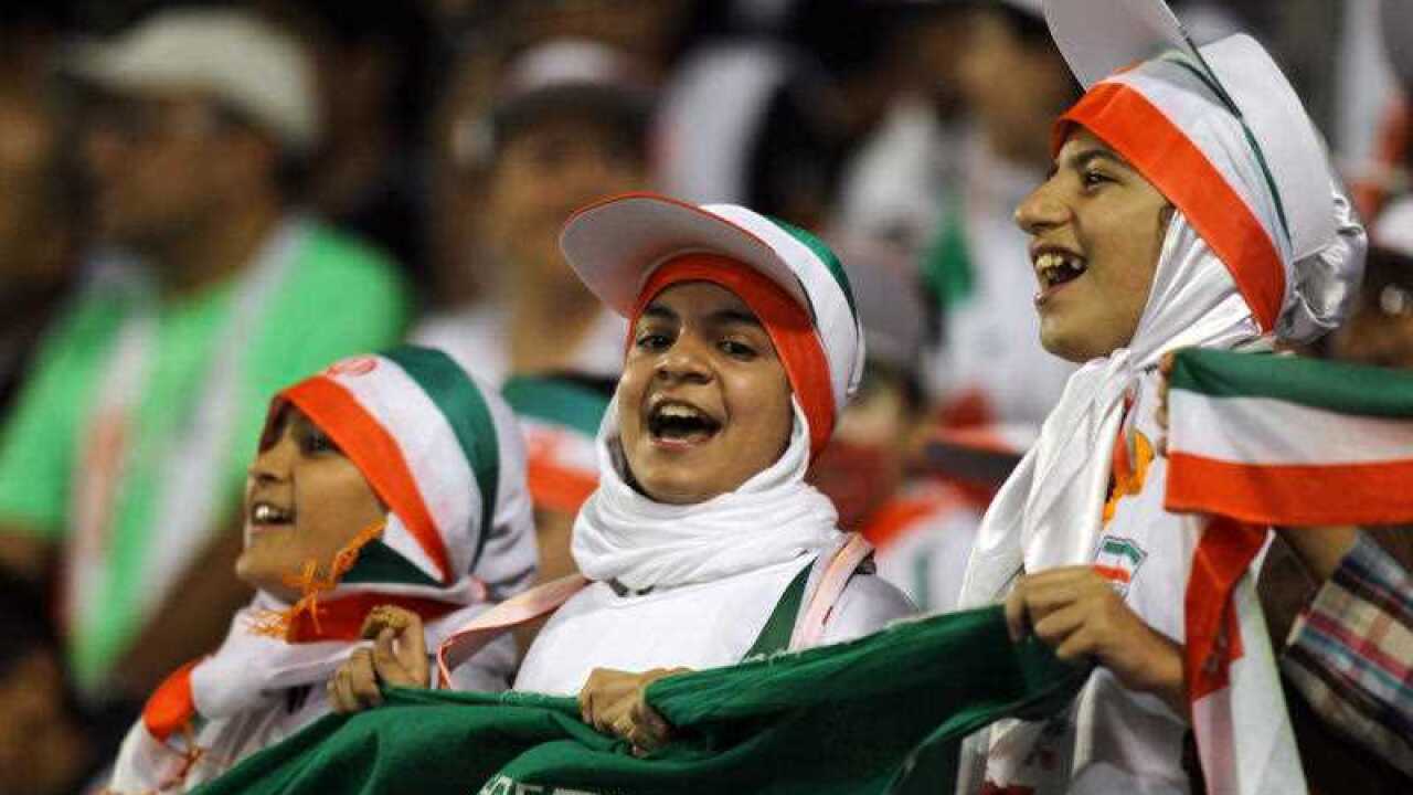 Iranian fans celebrate their team's win. 
