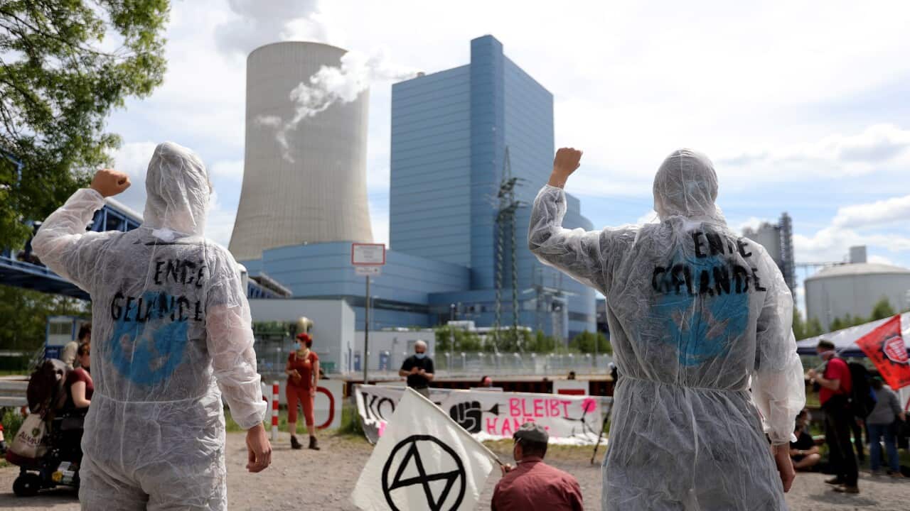 Demonstrators stage a protest against climate change at the coal-fired power plant in Datteln, Germany, 17 May 2020.