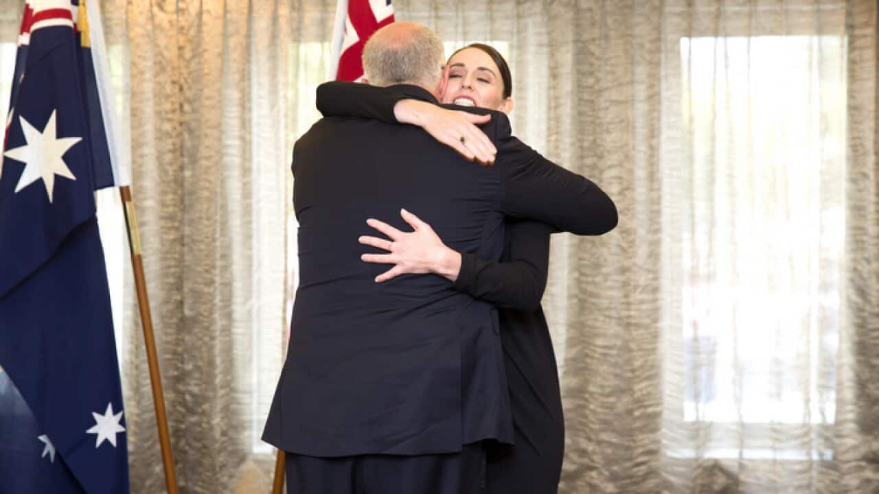 Australian PM Scott Morrison and NZ PM Jacinda Ardern hug, following the Remembrance service in Christchurch