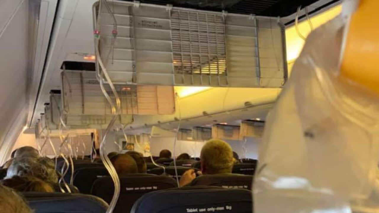 Masks dropped down for the passengers on the flight.