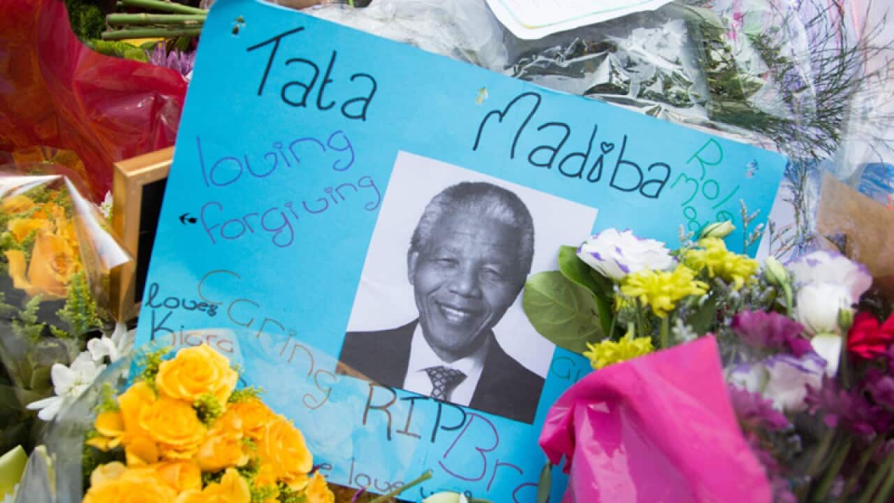 Farewell messages are left to Nelson Mandela outside his home