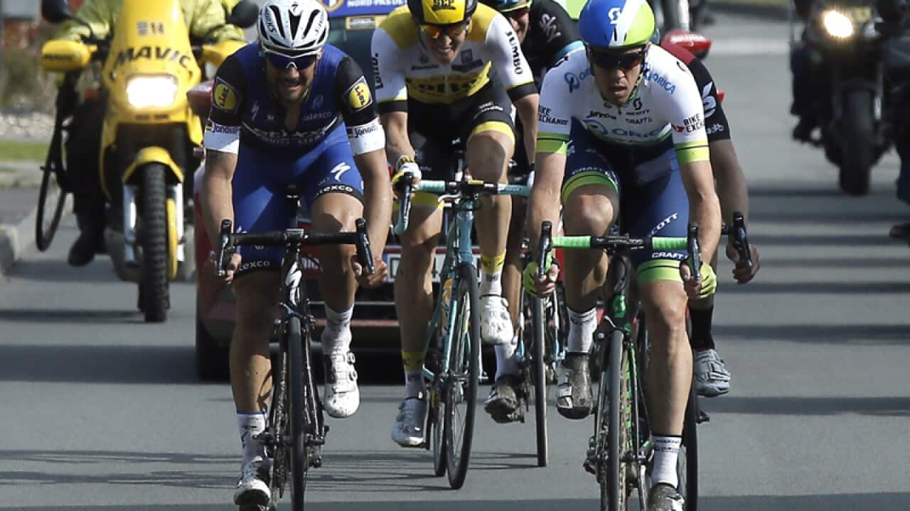 Orica GreenEdge team rider Mathew Hayman of Australia (R)