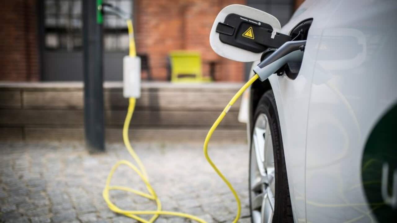 BERLIN, GERMANY - APRIL 24: An electric car is pictured during charging on April 24, 2018 in Berlin, Germany. (Photo by Florian Gaertner/Photothek via Getty Images)