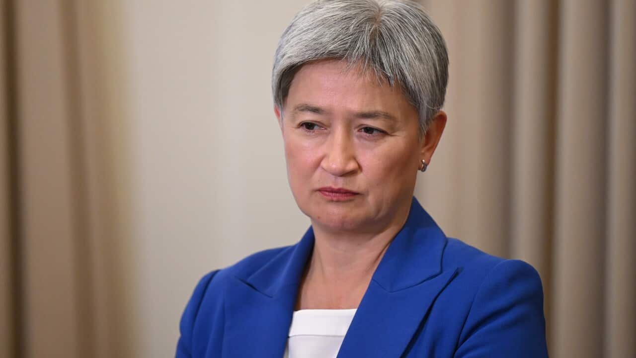 Penny Wong wearing a blue suit